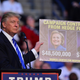 Donald Trump holds up a sign at a rally in Sunrise, Florida on August 10, 2016 (Photo by Johnny Louis/WireImage)